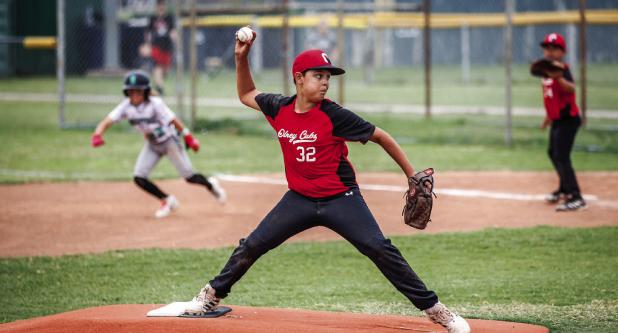 Olney Cub Pitcher #32 Denis “Sasquatch” Geter had a wicked fast ball and struck out several batters helping to secure a Championship title. Photo by Will Sadler