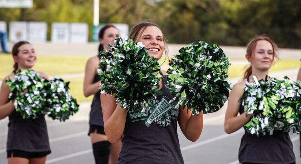 Newcastle Cheerleaders take advantage of the Bobcat scrimmage to practice new stunts and cheers. Back Row, left to right: Greenleigh Moore, Kinzee Forbus. Front Row, left to right: Kenzie King, Kourtney Whitfield Photo by Will Sadler
