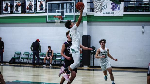 Bobcat #3 Keyton Newland put on an aerial assault against the Greyhounds, shown flying towards the basket for an easy bucket. Photo by Will Sadler