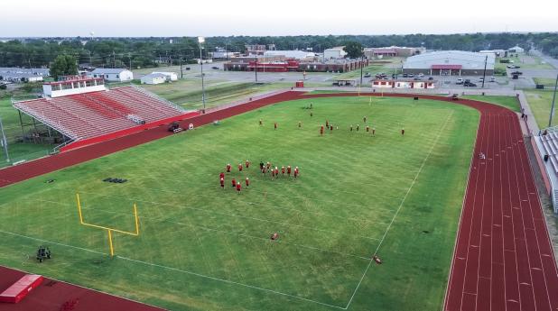 Cub football players began the year’s first practice on the Cub Stadium field, running a few routes before heading to the updated Cub practice field. Photo by Will Sadler
