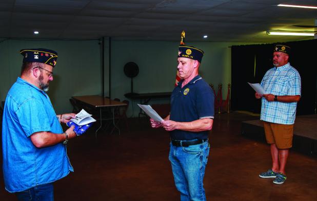 The Olney American Legion Post 414 performed a flag retirement ceremony on Sunday evening. The ceremony includes a flag inspection and prayer shown here. City Councilmember and Legion Chaplain Steven Nurre, Post Vice Commander Eric Loggins, and Post Comma
