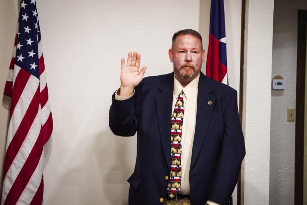 Olney’s new police chief, Bryan Barrett, took his oath of office before the Olney City Council at its Nov. 24 meeting. Photo by Will Sadler
