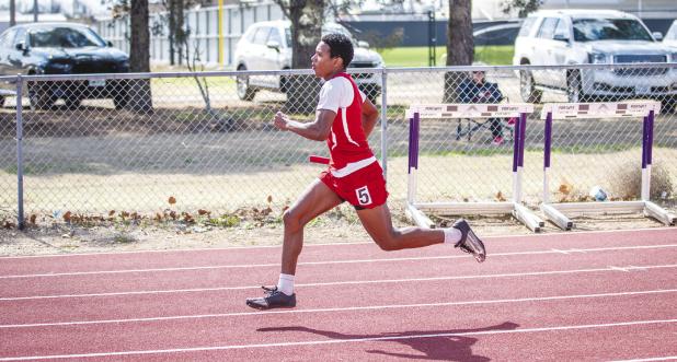 OHS runner Domonique Collins sprints to the finish in the 4x1 relay, pushing hard for teammates for their second-place finish. Photo by Will Sadler