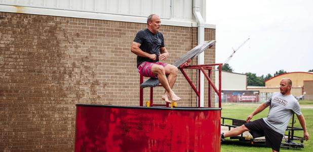 Most who attended the Olney Athletic Booster Club’s Tailgates and Tacos agreed the dunk tank was the most popular booth at the event. Taking one for the team Olney Junior High School Principal Ed Berngen took his turn as the dunked.