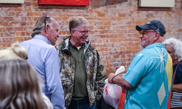 Precinct 3 Commissioner Alan Craig visits with Olney Economic Development Corporation executive director Tom Parker and Spencer and Debbie Key at Hudson’s. Photo by Will Sadler