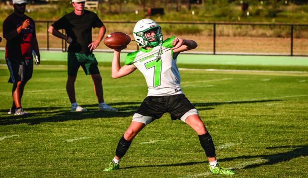 A Bobcat runs drills as a quarterback. Accuracy and strength combined with great scrambling skills are mandatory when playing Texas 6-man football. Photo by Will Sadler