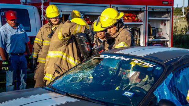 The Olney Volunteer Fire Department using the jaws of life to simulate an extraction of a wreck victim. Photo by Will Sadler