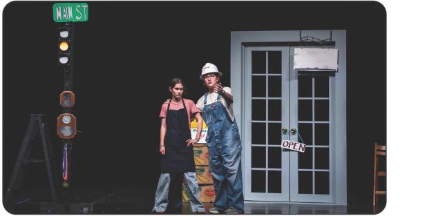 Two community members of the small town discuss town life, and the shop owner reveals her dislike of the stoplight. Photo by Will Sadler