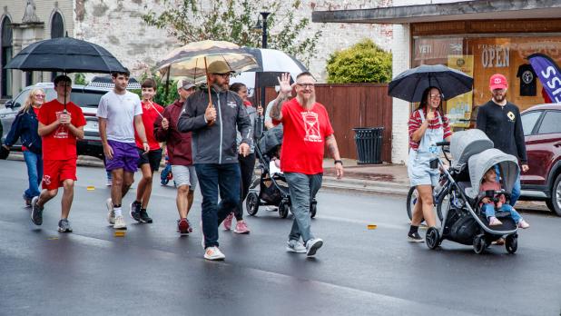 Photo by Will Sadler Marchers brought along umbrellas to shelter from a drizzle at the 28th annual March for Jesus.