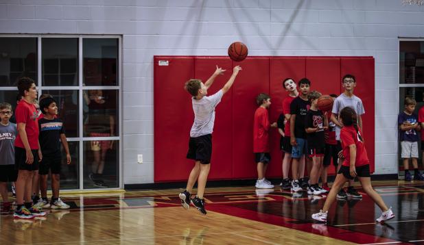 A Cub camper shoots from the paint, practicing shooting under pressure is an important to train. Photo by Will Sadler