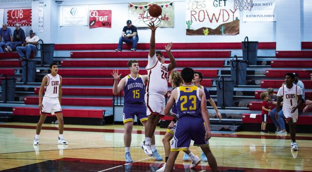 Few players have the passion of #24 Peyton Bedford, shown shooting a floater in the paint. Peyton is the heart of the Cub team. Photo by Will Sadler