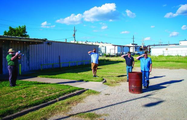 The second half of American Legion Post 414’s flag retirement ceremony took place outside and included the playing of “Taps” and the respectful burning of flags no longer in peak condition for displaying on flag poles. Photo by Will Sadler