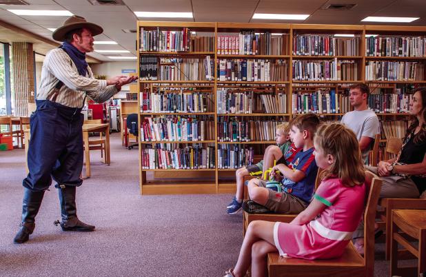Cowboy Nick Waters had children and adults hanging on every word as he told the tale of one of the many adventures of the Abernathy Boys during the OCLAC’s summer storytelling event. Photo by Will Sadler