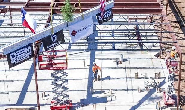 Construction crews “top off” the new Olney Hamilton Hospital building last week - hanging the final beam for the building. Photo by Will Sadler