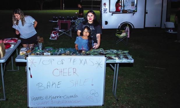 Olney’s Top of Texas Cheerlaaders hekd a bake sale at the Music in May concert, benefitting their sponsor and coach, Karrie Canada. Photo by Will Sadler