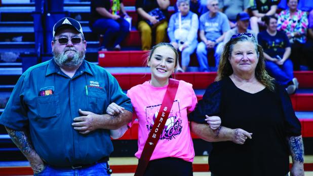 Lady Cub #7 Rai Bond escorted by parents James Bond and Kimberly Bond during Senior Night. Photo by Will Sadler