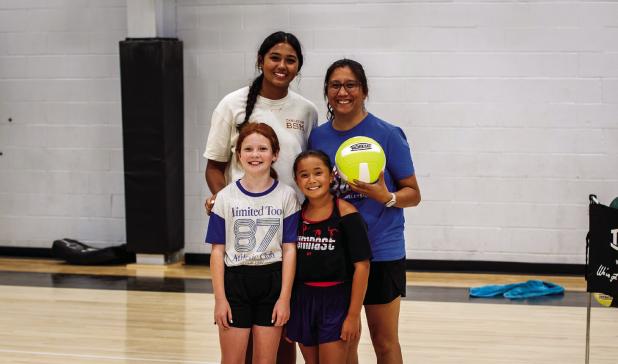 Former Ladycat Mya Cabrera [BL], LaTisha Jacoba [BR] Emory Shield [FL] and Brie Moulder, pose for a photo before beginning volleyball skills training. Photos by Will Sadler