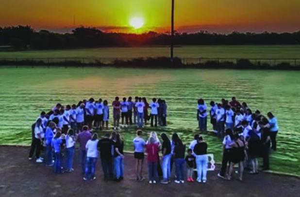 During the annual Senior Sunrise Rise gathering Seniors, parents and organizers gathered in a prayer circle to meditate on and pray over the seniors’ final year of high school. Photo by Will Sadler