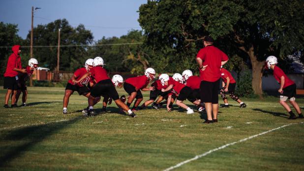 Cub offense and defense shake off the rust of a long summer running plays against each other. Photo by Will Sadler