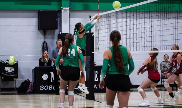 (TOP LEFT): NHS Ladycat #8 Kenzie King sends a volley over the net to Lady Maverick defenders, securing a point for the Ladycats. Photo by Will Sadler