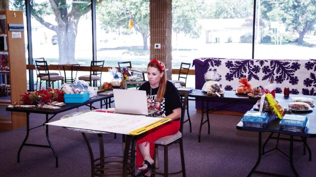 Alyssa Betts managing the auction for the Olney Community Library and Art Center [OCLAC] Texoma Gives live auction. OCLAC hosted an auction of sweet treats to raise funds for the annual 24-hour online giving event. Photo by Will Sadler
