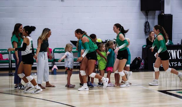 NHS Ladycats greet excited future Ladycat volleyball players before the matchup with the Eastland Lady Mavericks. Photo by Will Sadler