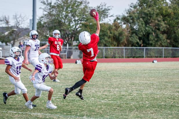 Cub #7 Ledger Bitner goes up for a reception that was just a bit to high. Photo by Will Sadler