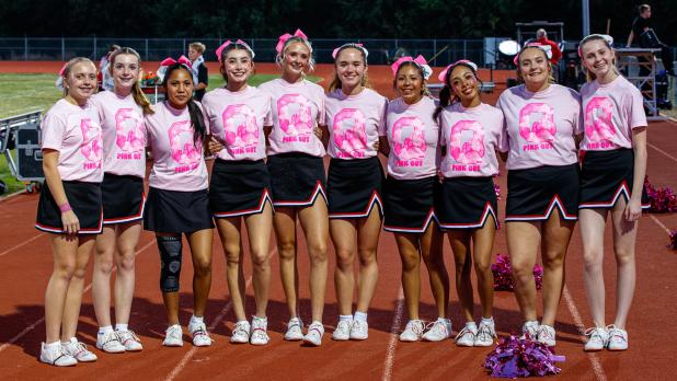 The OHS Varsity Cheerleaders game night. The cheerleaders keep the crowd in the fight with plenty of cheers, dance routines, and stunts. Photo by Will Sadler