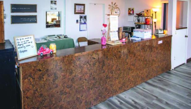 The lobby was the first space tackled by Jake Randall, the new owner of the Main Street motel he rechristened The Windmill. Six months after taking over the dilapidated property formerly known as The Pipeliner, he made great strides in rehabilitating its 