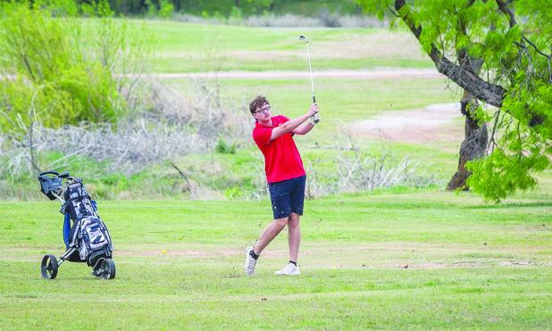 OHS Cub Luke Lane swings for the green at hole 2 at the Olney Country Clubs district competition. Photo by Will Sadler