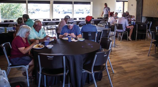 Golfers who played in the CEMCO tourney enjoyed a delicious catfish dinner Saturday night. Golfers trickled into the dinner at first, then flooded in as Round Two golfers finished their games. Photo by Will Sadler