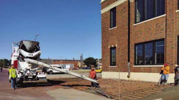 Construction crews repaired the sidewalk on the south side of the Olney Sub Courthouse to make way for a new access ramp and a child custody drop-off area with cameras. The old courthouse underwent a major restoration, including new HVAC, windows, paint, 