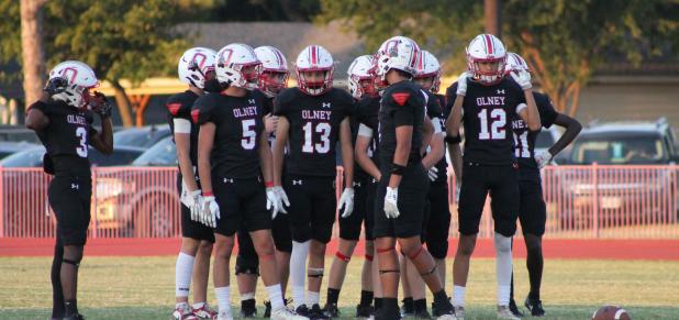 The 2026 Cubs scored their first win of the season at their Homecoming game in a see-saw battle with the Archer City Wildcats in a game that saw the Cubs exhibit growing skill and resilience. Here, players stand and confer during a break in game play at C
