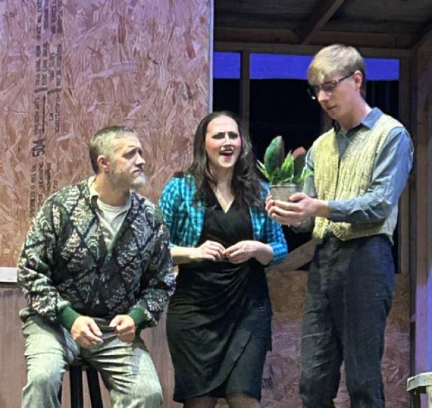 Jessie Berrier, Karyna Balch and Jack Page holding Audrey 2 during a recent dress rehearsal for Graham Regional Theatre’s summer musical, “Little Shop of Horrors.” Photo courtesy of GRT