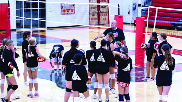 OHS Head Volleyball Coach Nicholas Tarr gives instructions before summer volleyball camp begins. Photo by Will Sadler
