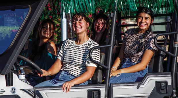 NHS Seniors ride in style down the Main Streets of Newcastle during HOCO week. Photo by Will Sadler