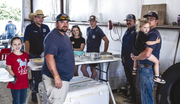 The annual NVFD fish fry takes a small army of workers to make the event a success but family, friends and community members rolled up their sleeves and worked side by side with firefighters feeding hungry attendees. Photo by Will Sadler