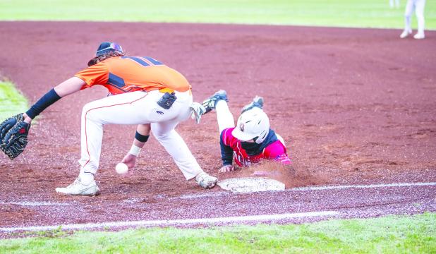 OHS Cub #8 Jamarcus Collins played cat and mouse with the Pirate Pitcher but after several attempts could not catch the Cub off base. Photo by Will Sadler