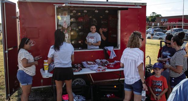 The Olney Athletic Booster Club trailer was very busy during the Meet the Cubs event thanks to great deals on Cub and Lady Cubs merchandise - $5 for everything! Photo by Will Sadler