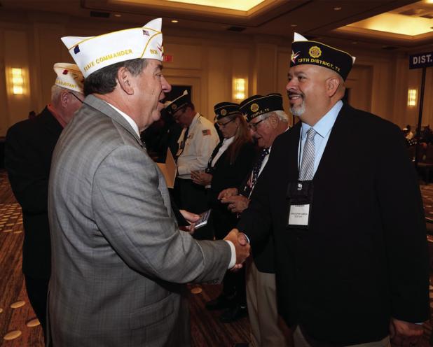Olney American Legion Post #414 Commander Chris Garcia shakes hands with outgoing State Commander Tom Marty after being swqorn in as District Commander. Photo courtesy of Chris Garcia