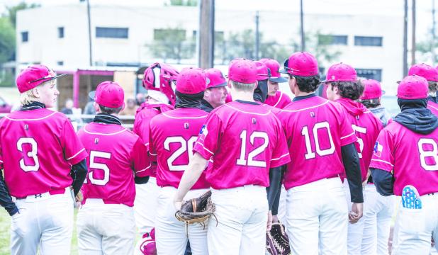 OHS Head Baseball Coach Jason Jacobs gives a pep/strategy talk to the Cubs during their matchup with rival Pirates. Photo by Will Sadler