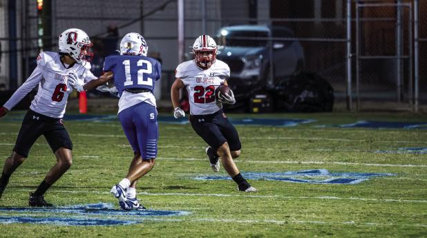 Cub running back #22 Kyle Stewart did what he could against a tenacious Bulldog defense. The Cubs made their best effort on the ground when passing was off for the night with many interceptions and incomplete passes. Photo by Will Sadler