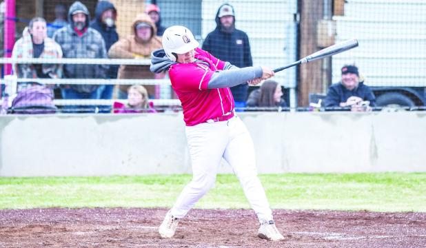 OHS Cubs short stop #21 Ricco Sandoval with a hit against the Pirates, Sandoval had 4 at bats, 1 run and 1 hit for the matchup. Photo by Will Sadler