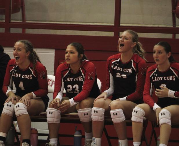 The Olney Lady Cubs battled Bellevue Lady Eagles on Sept. 16 and added another series to the win column. Standouts in the 3-1 victory were Bradi Bower (L), Morgan Simmons (Center) and teammates who cheered for the win. Photo by Angel Turner