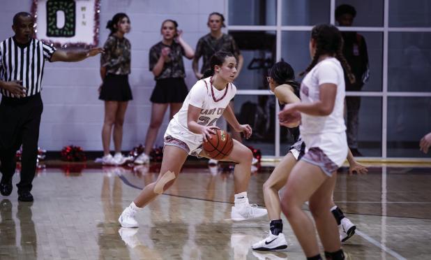 OHS Lady Club #24 Angel Turner plays with calm controlled aggression on defense keeping shooters on their toes. Angel scored 2 points for the night. Photo by Will Sadler