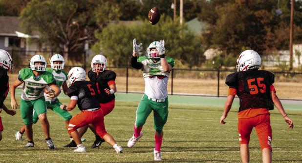 A Bobcat defender takes advantage of a rushed Rotan quarterback with an interception. Photo by Will Sadler