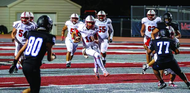 Cub #11 Tucker Cortinez QB scrambling out of the pocket, keeping the drive alive. Photo by Will Sadler