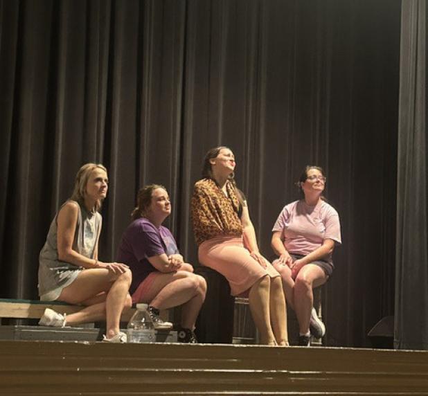 Summer Branum, Stormie Harris, Karyna Balch, and Catherine Smith run their lines during a recent rehearsal for the Graham Regional Theatre’s production of “Little Shop of Horrors,” opening Friday and running through Sunday. Photo courtesy of GRT