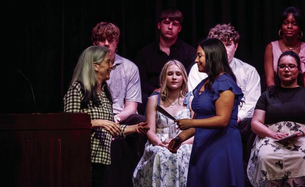 The L F & Carla Perry Foundation awarded merit-based scholarships to OHS students and presented the first-ever journalism scholarships for three students who worked at the Olney Enterprise newspaper for two years. Enterprise editor Gina Keating gives