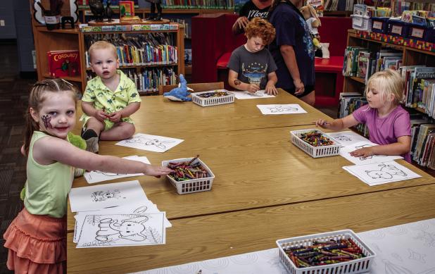 The art station was a popular spot inside the Olney Library during the annual pet show. Photo by Will Sadler
